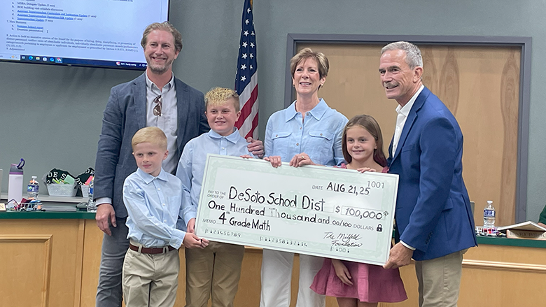Milfeld surprises wife, rest of De Soto school board with $100,000 donation